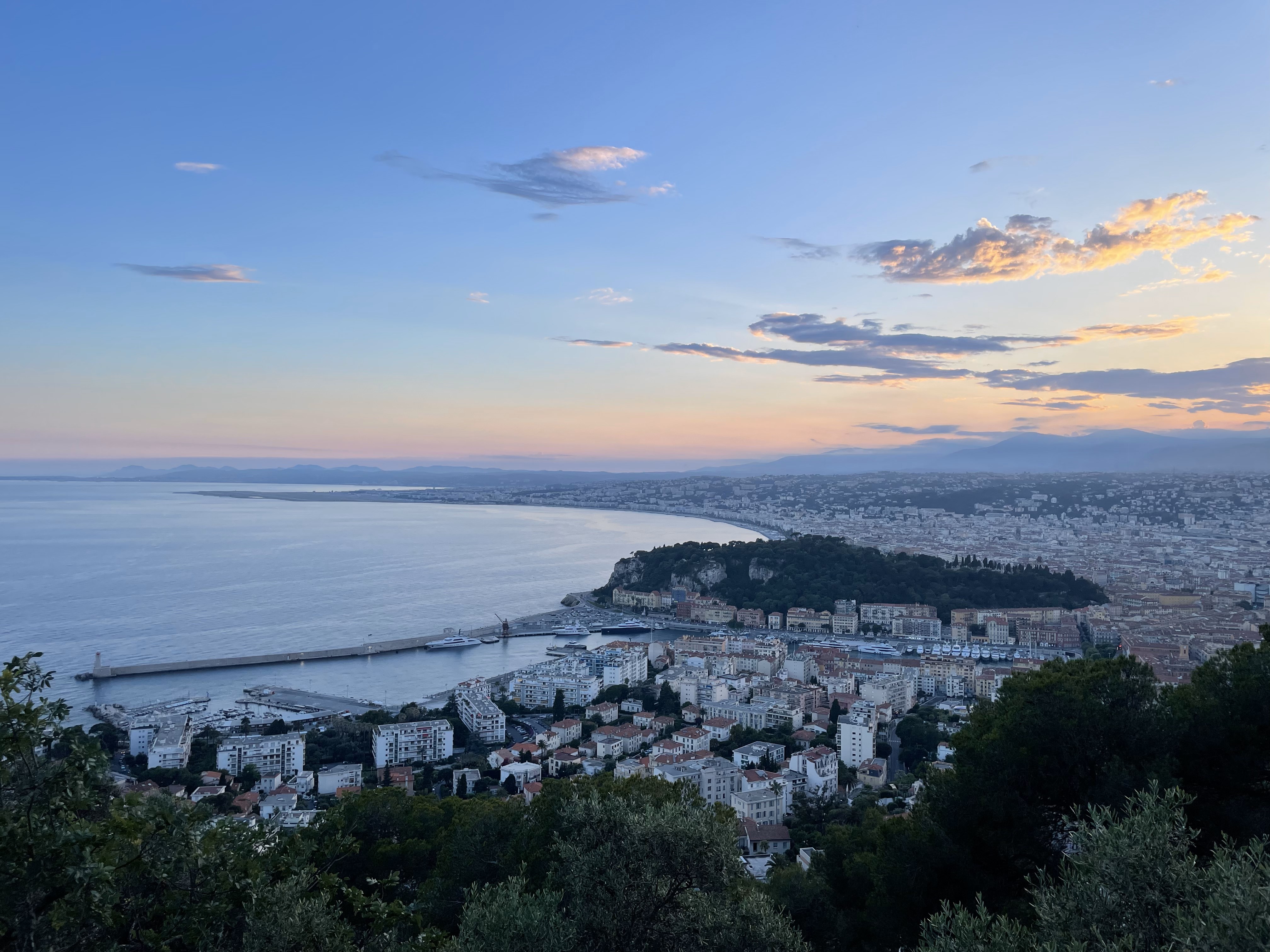 Monaco night panorama with Port Hercules and yachts twinkling below